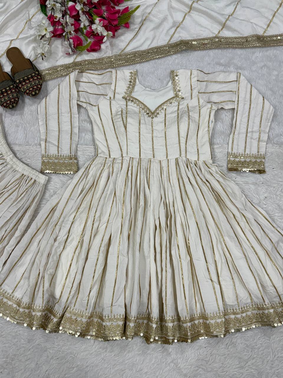 Radiant Rose Pink Flared Peplum Kurti and Sharara Set Embellished with Luminous Gold Zari Stripes and Sequined Borders